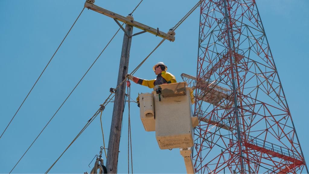 Lineworker upgrading the grid