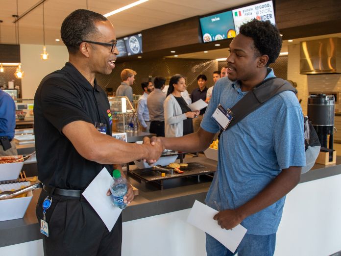 Vice president of Human Resources, Darius Johnson,  welcomes student intern.